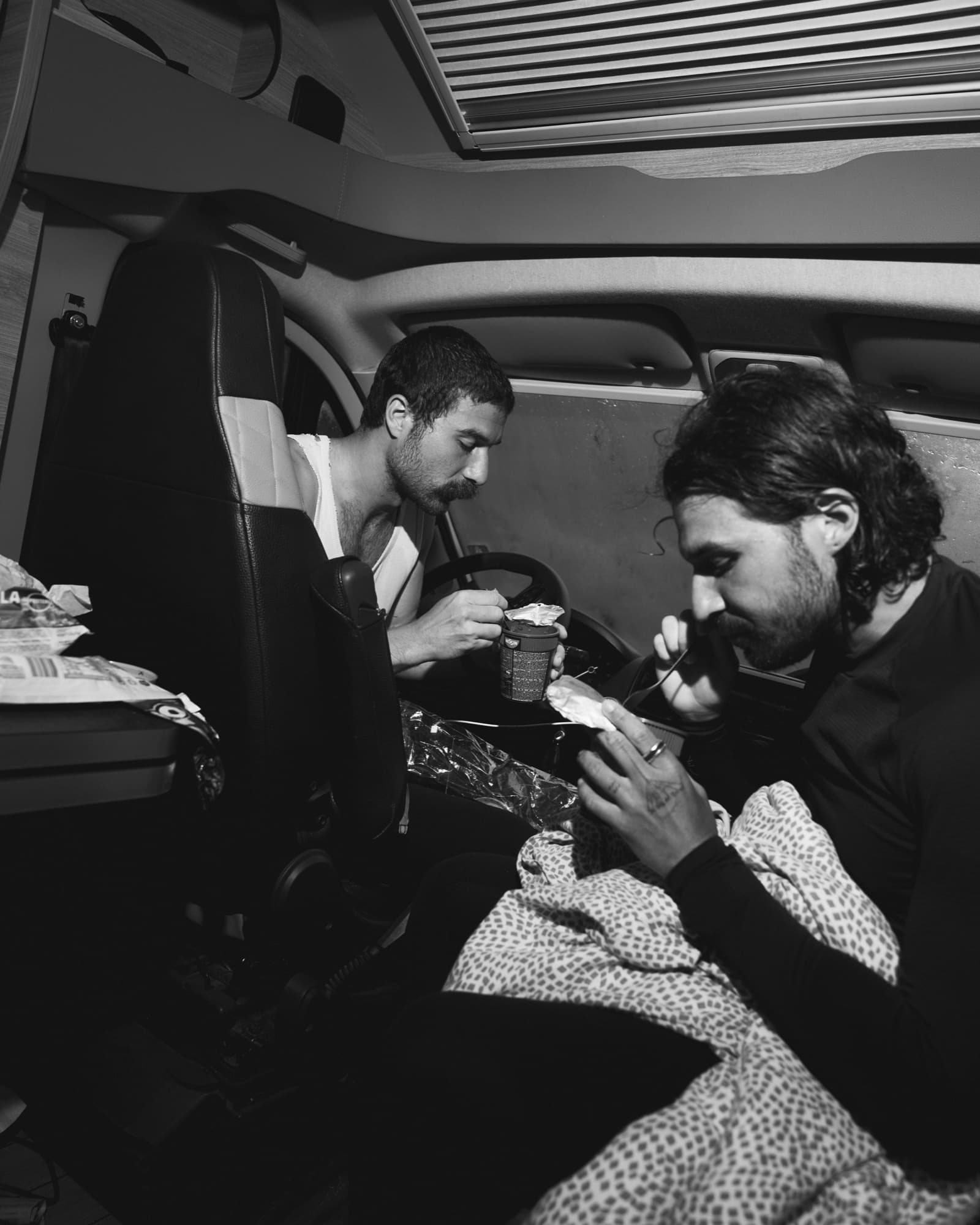 Lucas and his brother resting in the camper van during the Greece run
