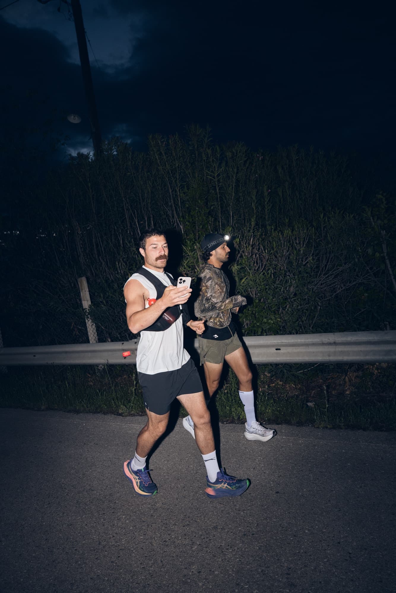 Lucas and his brother running together at night